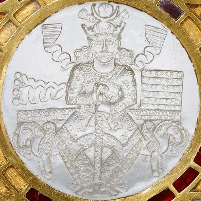 A Sasanian-era silver medallion depicting a crowned king